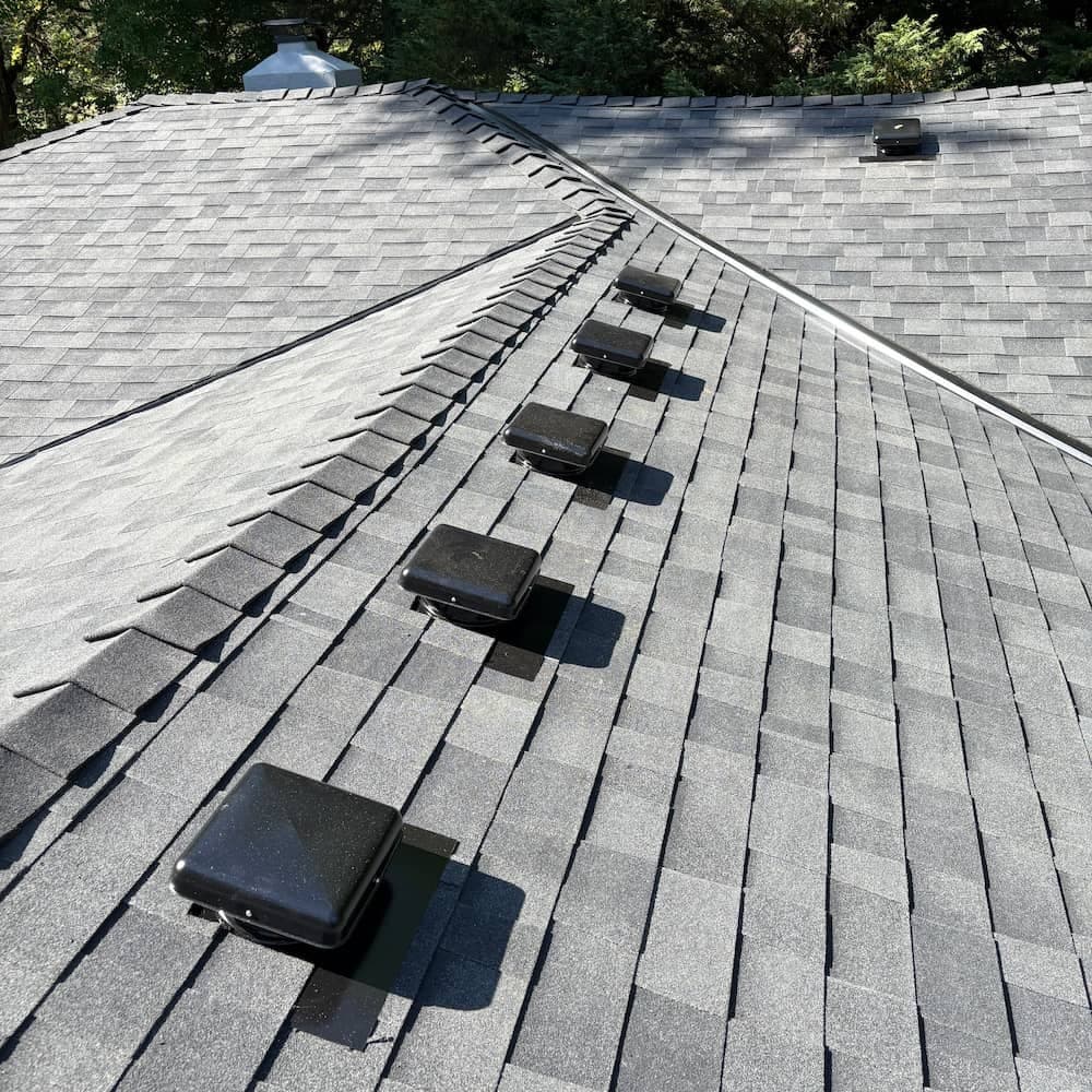 Light colored asphalt shingle roof installation